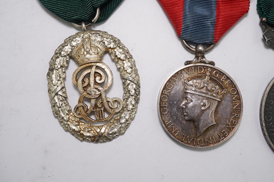 Three assorted service medals; Ed VII Volunteer Officer's Decoration hallmarked for 1905; GV Imperial Service medal to Walter Charles Cornish; GVI Territorial Efficiency medal to 2062789 . S/Sgt. L.W.Sergeant. R.A. Condi